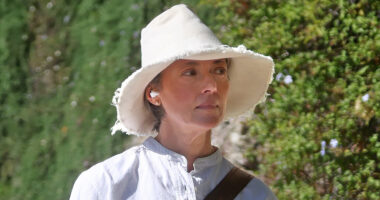 80s movie bombshell, now 58, looks chic in white on walk with dogs in very rare sighting – who is she?