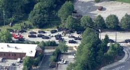 College students at Emory in Georgia, were told to run, hide, or fight following the active shooter alert (Pictured: An aerial view of the massive police presence near the college)