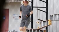 All smiles: Elizabeth Holmes flashed a smile as she was seen working out Saturday at Federal Prison Camp Bryan, the minimum-security facility Ghislaine Maxwell was transferred to