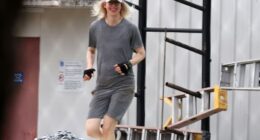 All smiles: Elizabeth Holmes flashed a smile as she was seen working out Saturday at Federal Prison Camp Bryan, the minimum-security facility Ghislaine Maxwell was transferred to