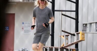 All smiles: Elizabeth Holmes flashed a smile as she was seen working out Saturday at Federal Prison Camp Bryan, the minimum-security facility Ghislaine Maxwell was transferred to