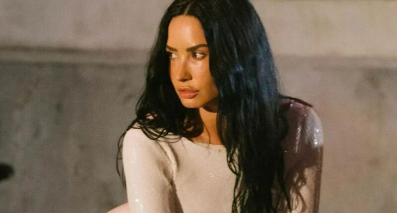 Demi Lovato channels Kim Kardashian as she looks incredible in white mini-dress to film new music video