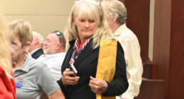 Jeani Duarte arriving in court last July, among the partisans of Mayor Mike Norris, who was suing the city. Duarte is a candidate for the Palm Coast City Council. (© FlaglerLive)