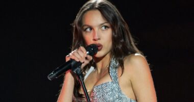 Olivia Rodrigo puts on leggy display in tiny silver miniskirt and matching corset for Lollapalooza performance