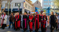 Catholic bishops invited by Mark Seitz, center, the bishop of El Paso, Texas, lead a march in solidarity with migrants on March 24, 2025, in downtown El Paso.